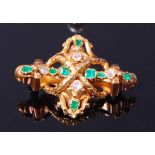 A Victorian yellow metal, emerald and diamond set brooch by Garrard & Co,