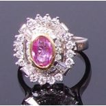 A contemporary white metal, pink sapphire and diamond set dress ring,