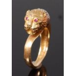 A modern 18ct gold, sapphire and ruby set dress ring, modelled as a lion mask,