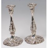 A pair of early Victorian silver Rococo Revival candlesticks,