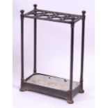 *A Victorian cast iron eight division stick-stand with drop-tray, w.42cm, d.22cm, h.