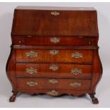 An early 19th century walnut bombe bureau,