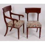 A set of fourteen William IV style mahogany dining chairs, each having barback over stuffover seat,