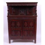 *An early 19th century joined oak and specimen marquetry inlaid court cupboard,