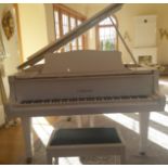 A contemporary Yamaha baby grand piano, in white lacquered case, with iron framed movement,