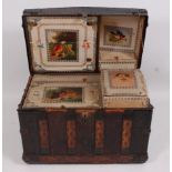 An early 19th century beech studded leather clad and iron bound dome-top travelling trunk,