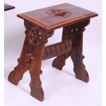 *An 18th century pegged oak stool, having a pierced and carved top with moulded edge,