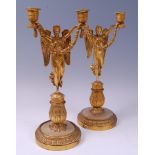 A pair of early 19th century French Empire gilt bronze candelabra,