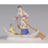 A Meissen porcelain group of a Mandarin woman with child and heron in a boat,