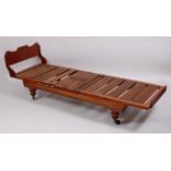 A 19th century mahogany campaign bed, having double rise-and-fall ratchet action,