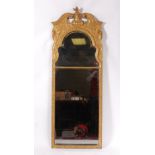 A George II giltwood and gesso pier glass,