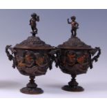 A pair of mid-19th century Italian heavy cast and patinated bronze twin handled pedestal urns and