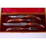 A late Victorian oak cased two piece carving set, the steel blades stamped Harris & Brothers Halsom,
