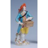 A Meissen porcelain figure 'The Peep-Show Man',