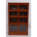 An Edwardian mahogany and satinwood banded four-tier Globe Wernicke sectional bookcase,