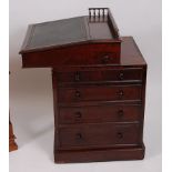 A 19th century mahogany campaign style writing davenport, having three-quarter gallery,