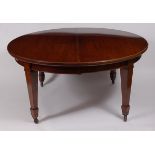 A C19th mahogany extending dining table, the top having wind-out action, two extra leaves,