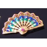 An 18ct gold, ruby and enamelled brooch, in the form of a fan, 11g,