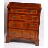 A mid-18th century style flame walnut curl feather and cross banded bachelors chest,