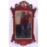 *A 19th century mahogany and parcel gilt wall mirror, in the Chippendale style,