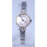 An Art Deco ladies 18ct white gold and diamond cased cocktail watch,