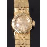 A ladies 18ct gold cased Rolex cocktail watch, having a signed champagne dial with baton markers,