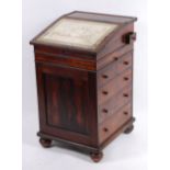 A George IV rosewood slopefront davenport by Gillows of Lancaster,