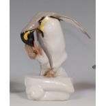 A modern Meissen porcelain penguin preening its plumage, underglaze blue crossed sword mark,