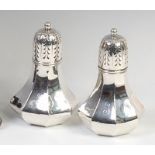 A near-pair of Edwardian silver sugar sifters, one stamped Tiffany & Co,