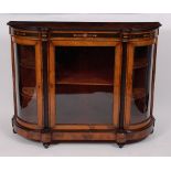 A Victorian figured walnut and inlaid credenza, having twin bowed doors flanking centre glazed door,