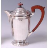 A George V silver hot water jug, of fluted tapering form,