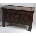 *A circa 1700 oak three panel coffer, the top with mouldings and one original loop hinges,