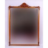 *An early Victorian mahogany overmantel mirror, having acanthus leaf carved pediment and corners,