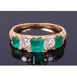 An early 20th century 18ct gold, emerald and diamond ring,