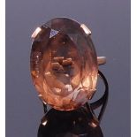 A modern 9ct gold smoky topaz set dress ring, the oval cut topaz measuring approx 25 x 18 x 13mm,