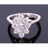 An 18ct white gold diamond flower head cluster ring,