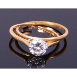 An 18ct gold diamond solitaire ring, the claw set brilliant weighing approx 1.