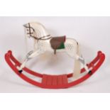 A Lines extra carved dapple-grey rocking horse, on bowed base,