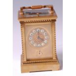 A French style lacquered brass carriage clock, having visible platform escapement,