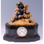 A late 19th century French gilt and patinated bronze black slate mantel clock,