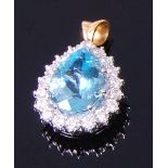 An 18ct gold, aquamarine and diamond pendant,