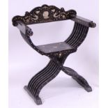 *A 19th century Continental ebonised and ivory inlaid X-framed chair,