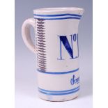 *A French Sinceny faience pottery jug, of plain cylindrical form,