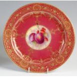 A Royal Worcester bone china cabinet plate, decorated with fruit within a puce ground,