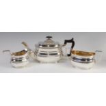 A George V silver three-piece tea set in the Regency style, comprising teapot ,