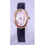 A ladies 18ct gold Cartier Baignoire wristwatch, having signed silvered dial with Roman numerals,
