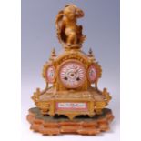 A 19th century French gilt metal and porcelain inset mantel clock,