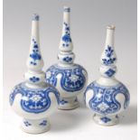 *A pair of Chinese Kangxi period porcelain water sprinklers, each of triple gourd bottle shape,