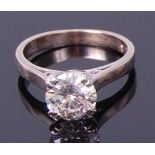 An 18ct white gold diamond solitaire ring, the four claw set brilliant weighing 1.