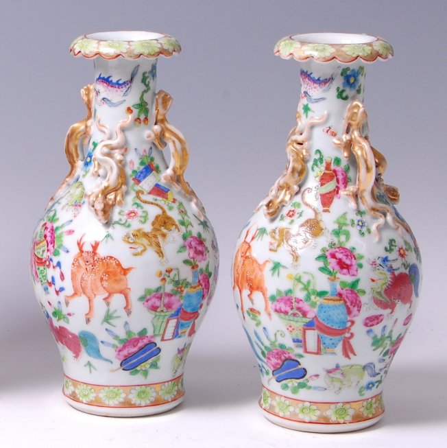 A pair of late 19th century Chinese Canton enamel decorated vases,
